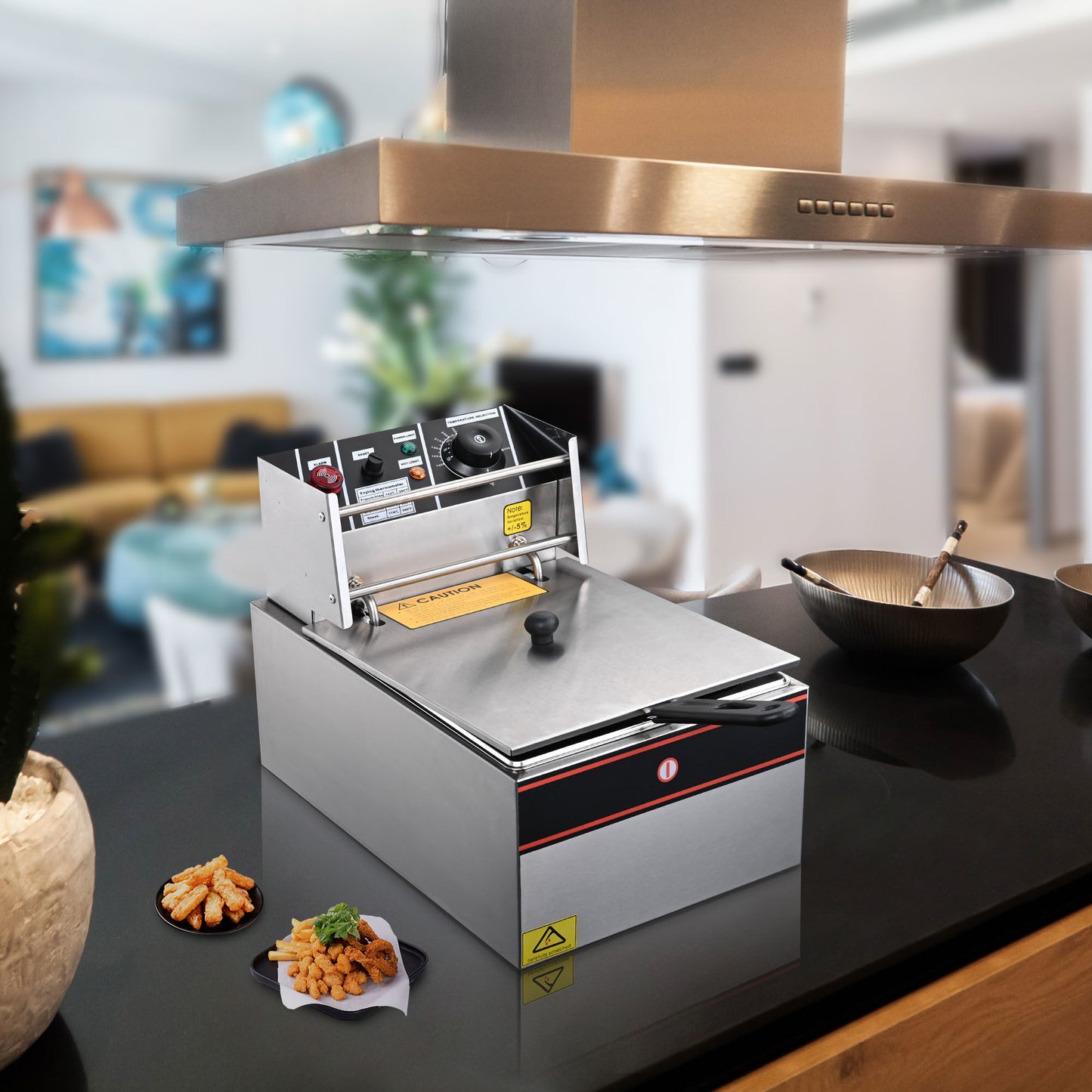 Deep Fryer displaying cooking with the lid on and the finished products.